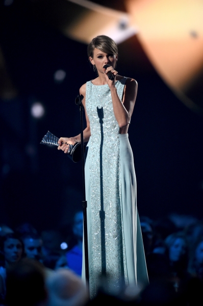 Taylor Swift accepting 50th Anniversary Milestone Award at Academy of Country Music Awards 2015.